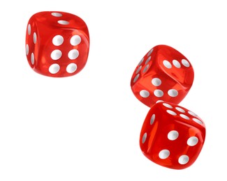 Three red dice in air on white background