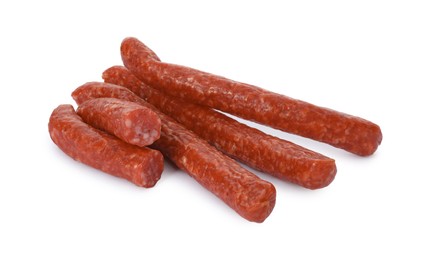 Photo of Thin dry smoked sausages isolated on white