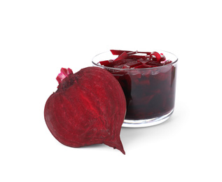 Photo of Pickled beets in glass bowl and half of vegetable isolated on white