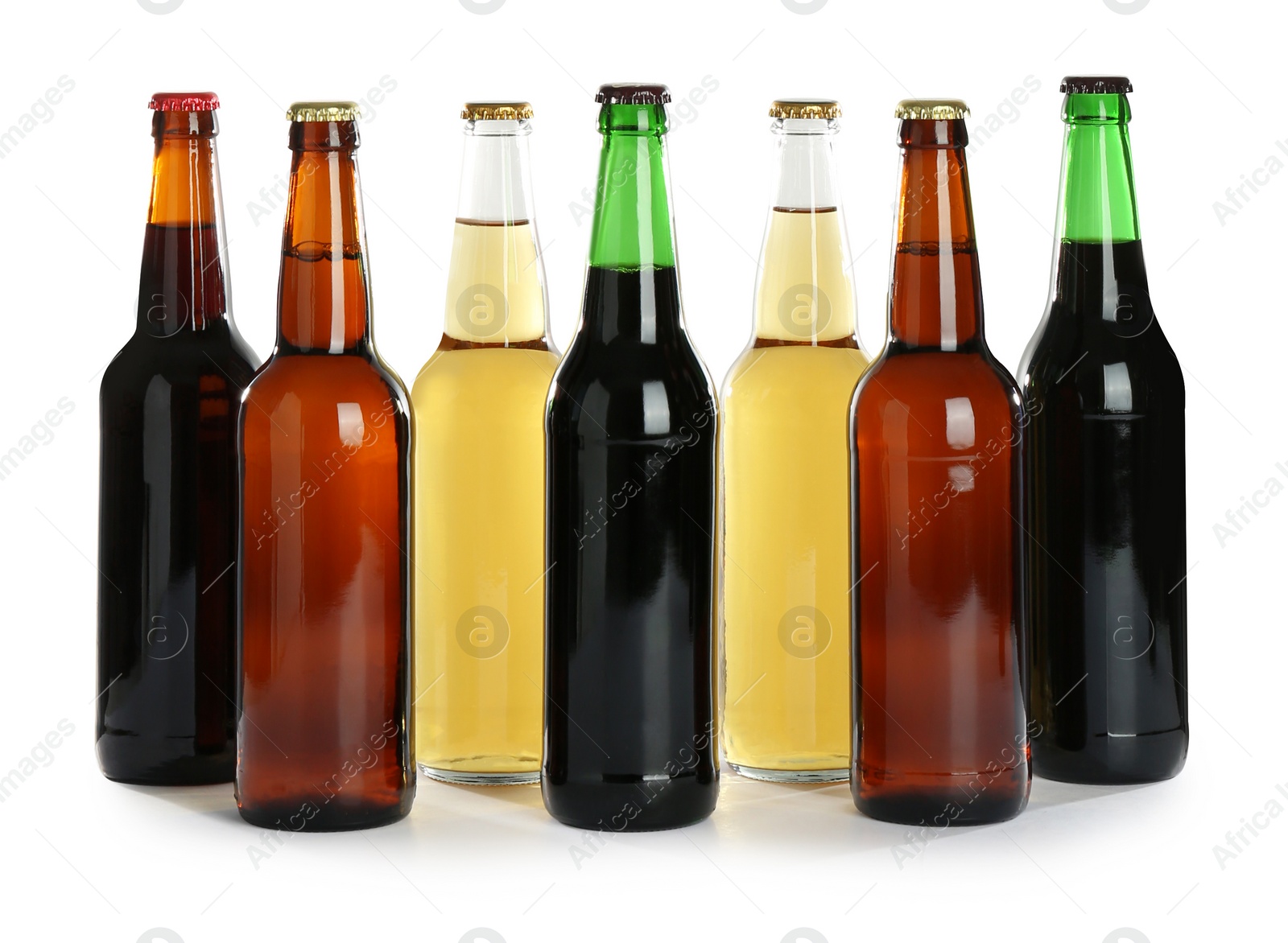 Photo of Bottles with different beer on white background