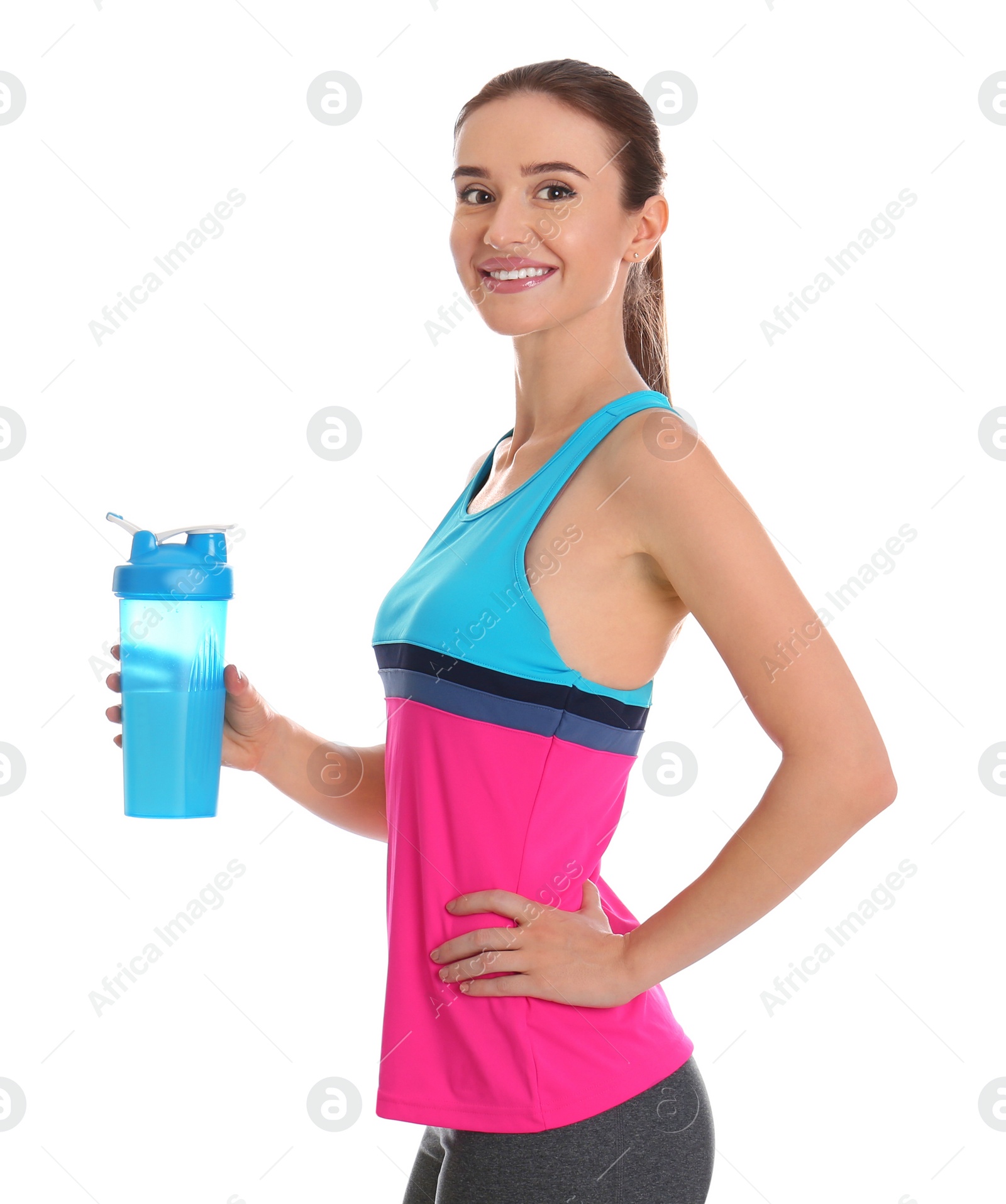 Photo of Athletic young woman with protein shake on white background