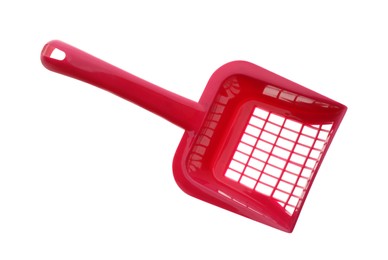 Photo of Red plastic scoop for cat litter isolated on white, top view