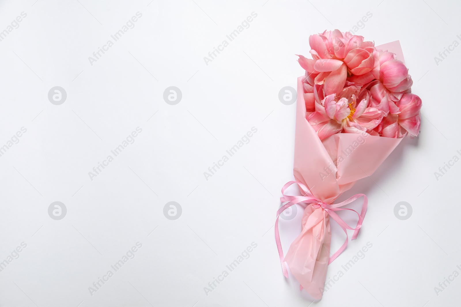 Photo of Beautiful bouquet of pink peonies on white background, top view