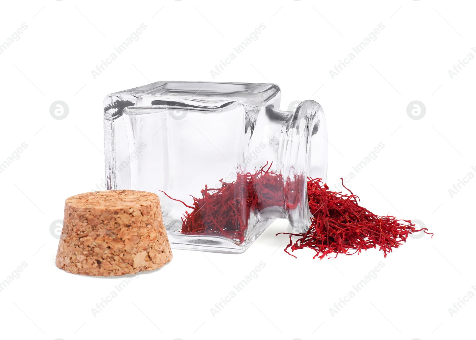 Photo of Aromatic saffron and glass jar isolated on white