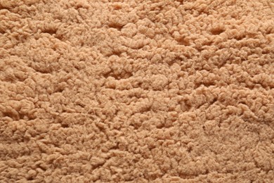 Texture of brown faux fur as background, closeup