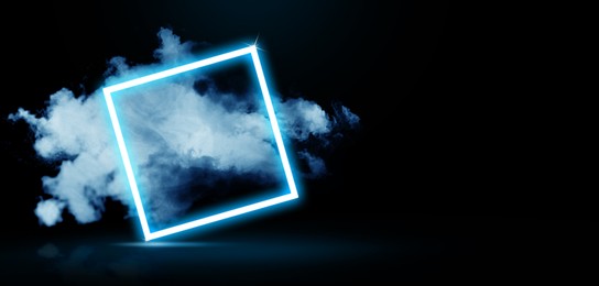 Image of Glowing square blue neon frame with smoke on black background. Banner design with space for text