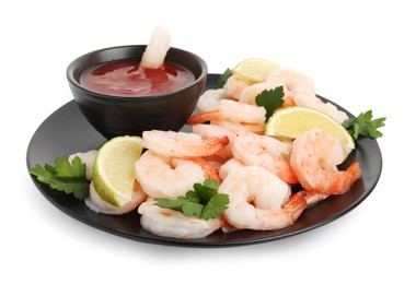 Tasty boiled shrimps with cocktail sauce, lime and parsley isolated on white