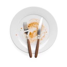 Photo of Dirty plate and cutlery on white background, top view