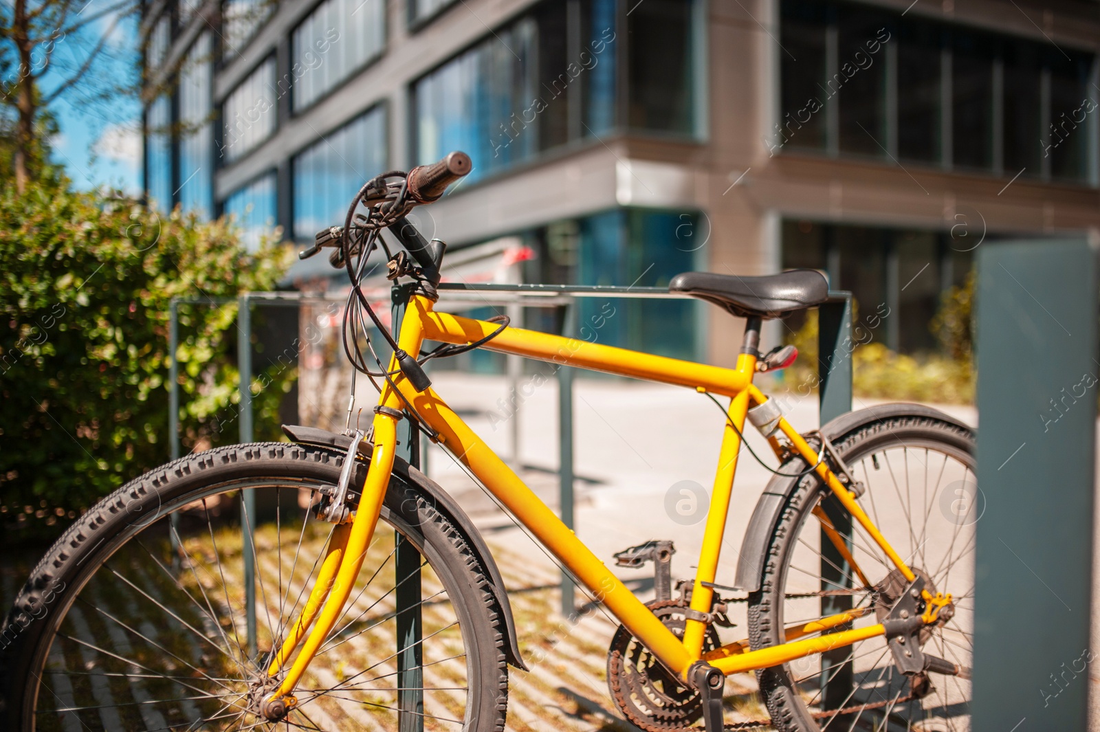 Photo of Bright bike on street near building outdoors