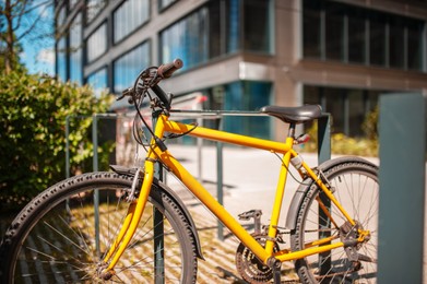 Photo of Bright bike on street near building outdoors