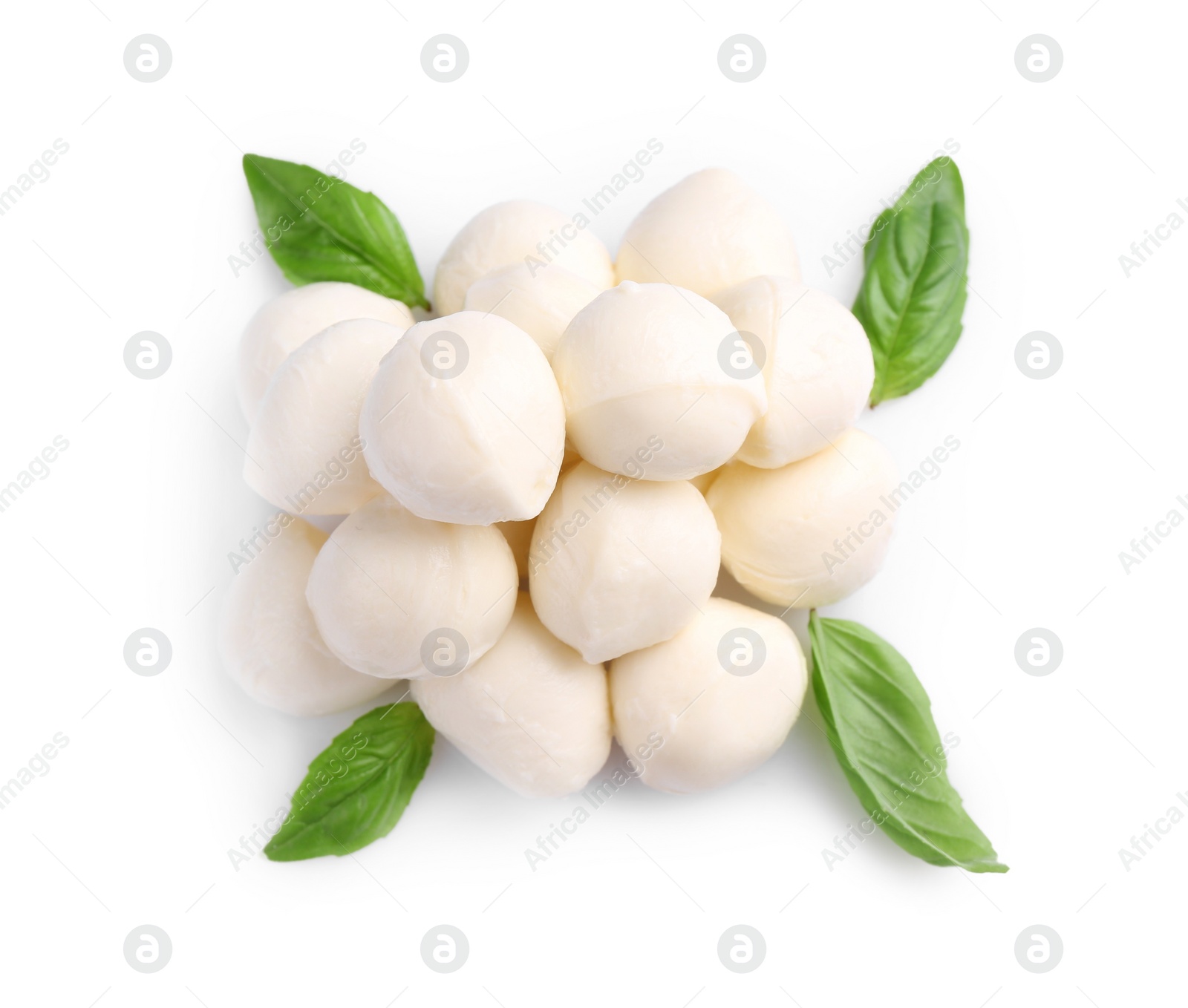 Photo of Tasty mozzarella balls and basil leaves isolated on white, top view