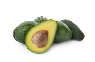 Photo of Ripe avocados on white background. Tropical fruit