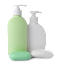 Photo of Soap bars and bottle dispensers on white table