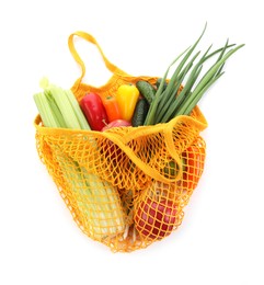 String bag with vegetables and fruits isolated on white, top view