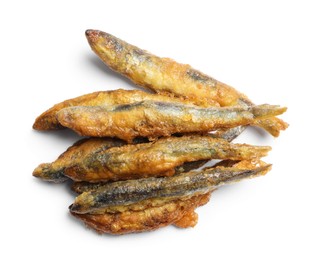 Photo of Pile of delicious fried anchovies on white background, top view