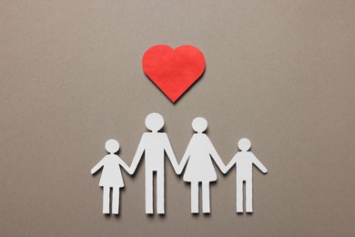 Photo of Paper family figures and red heart on light grey background, flat lay. Insurance concept