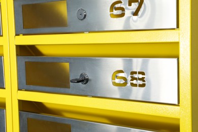 Photo of New metal mailbox with key and numbers, closeup
