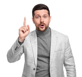 Photo of Handsome bearded businessman in suit pointing at something on white background