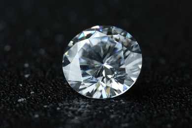 Beautiful shiny diamond on black background, closeup