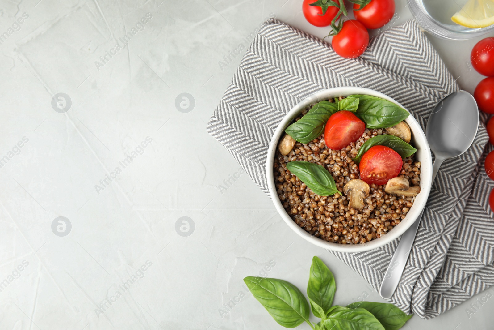 Photo of Flat lay composition with delicious buckwheat porridge on table, space for text