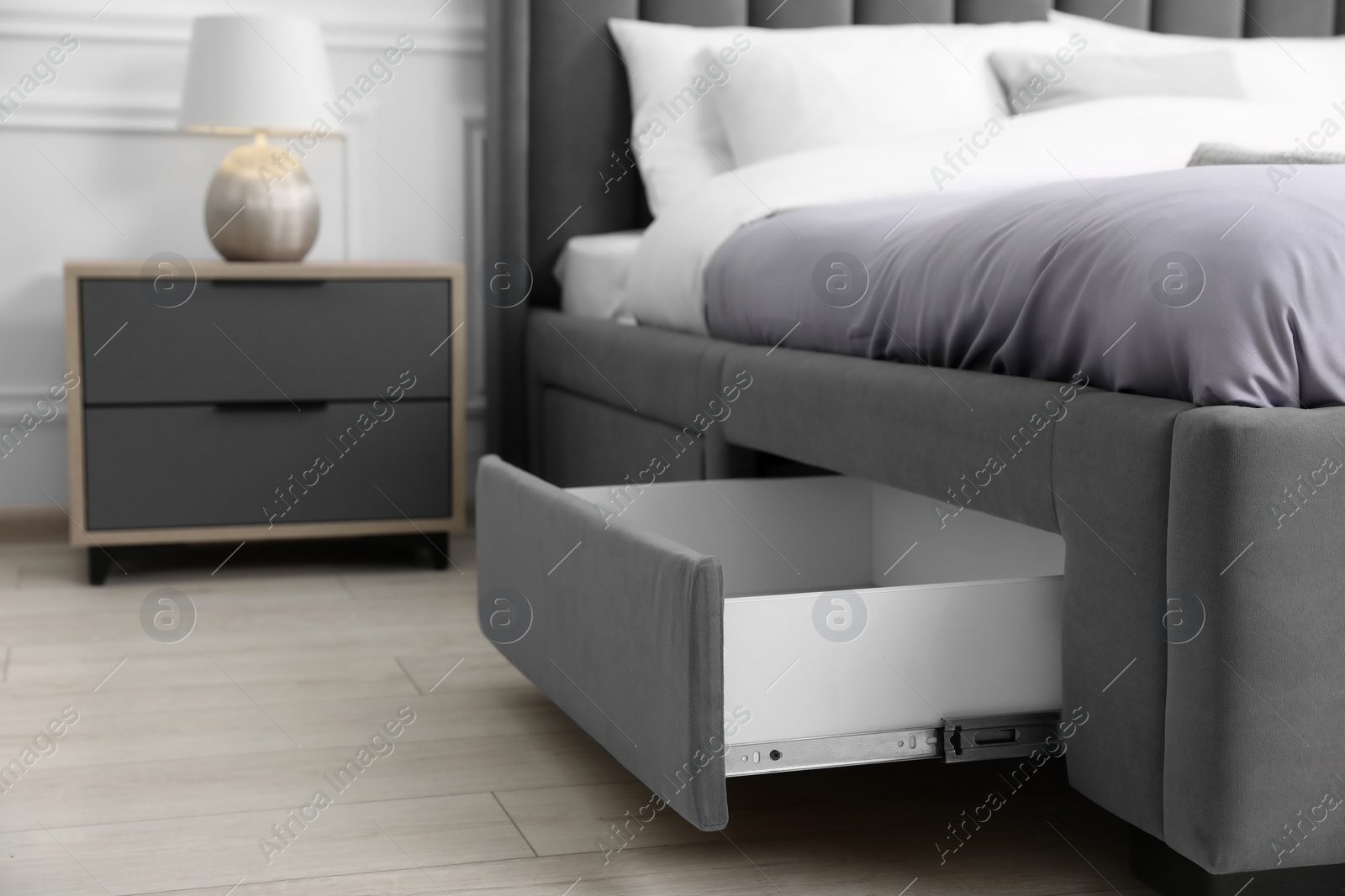 Photo of Storage drawer for bedding under modern bed in room