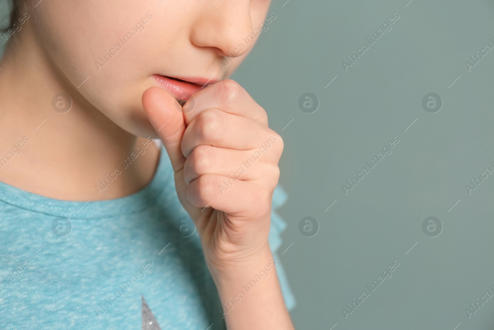 Photo of Girl coughing on color background, closeup
