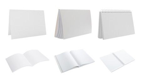 Image of Set with blank paper brochures on white background. Mockup for design