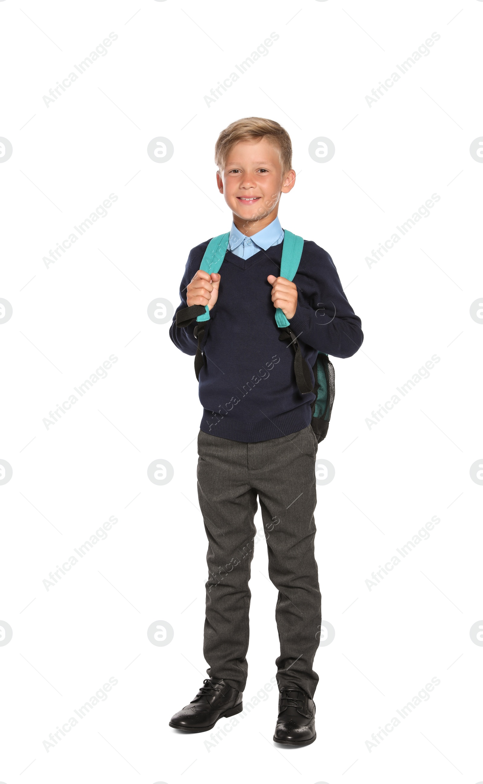 Photo of Little boy in stylish school uniform on white background