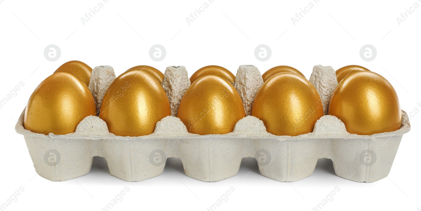 Photo of Many shiny golden eggs in carton on white background