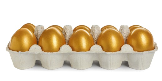 Photo of Many shiny golden eggs in carton on white background