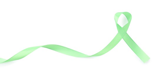 Photo of Light green awareness ribbon isolated on white, top view