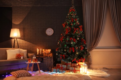 Photo of Stylish room interior with decorated Christmas tree