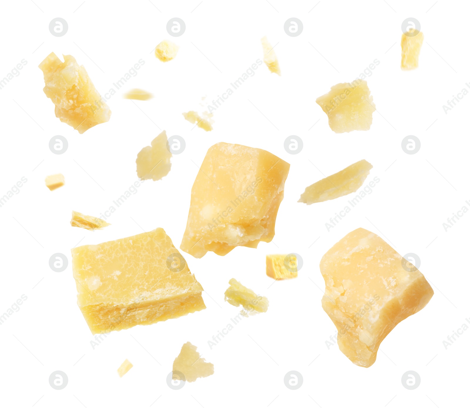 Image of Pieces of delicious parmesan cheese flying on white background