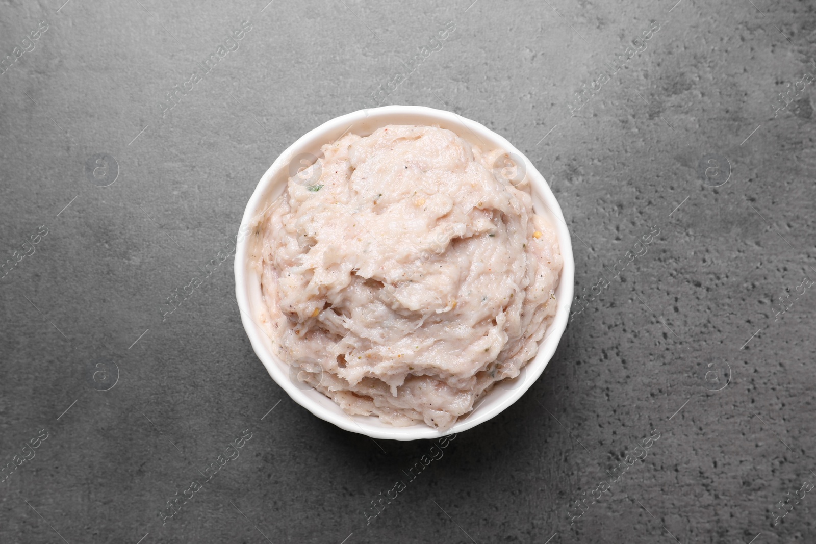 Photo of Delicious lard spread on grey table, top view