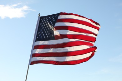 American flag fluttering outdoors on sunny day