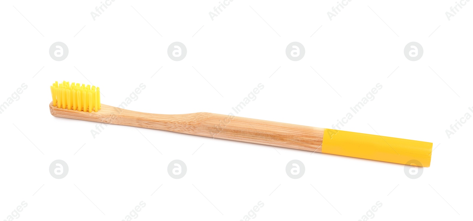 Photo of Bamboo toothbrush with yellow bristle isolated on white