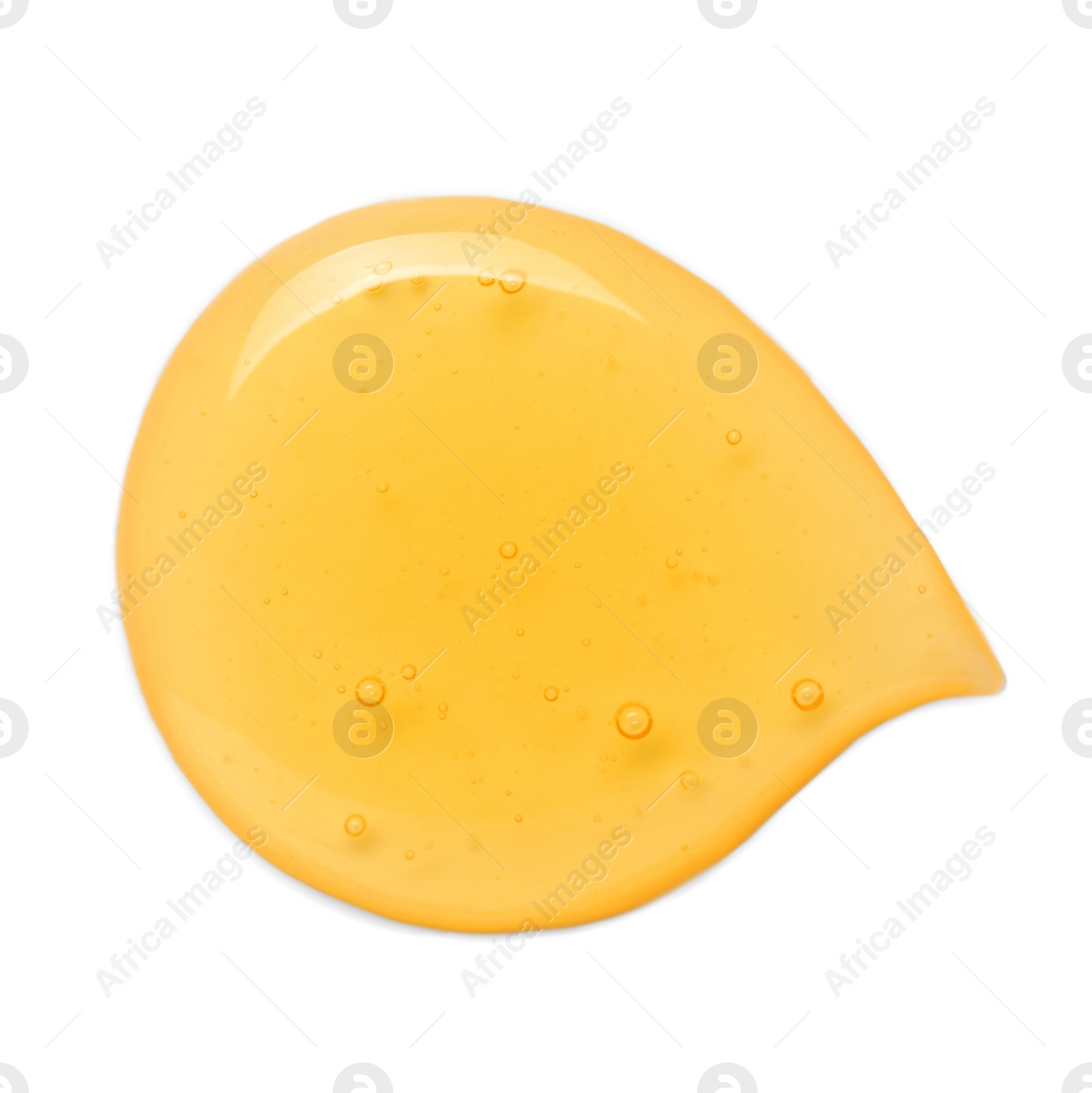 Photo of Drop of tasty natural honey isolated on white, top view