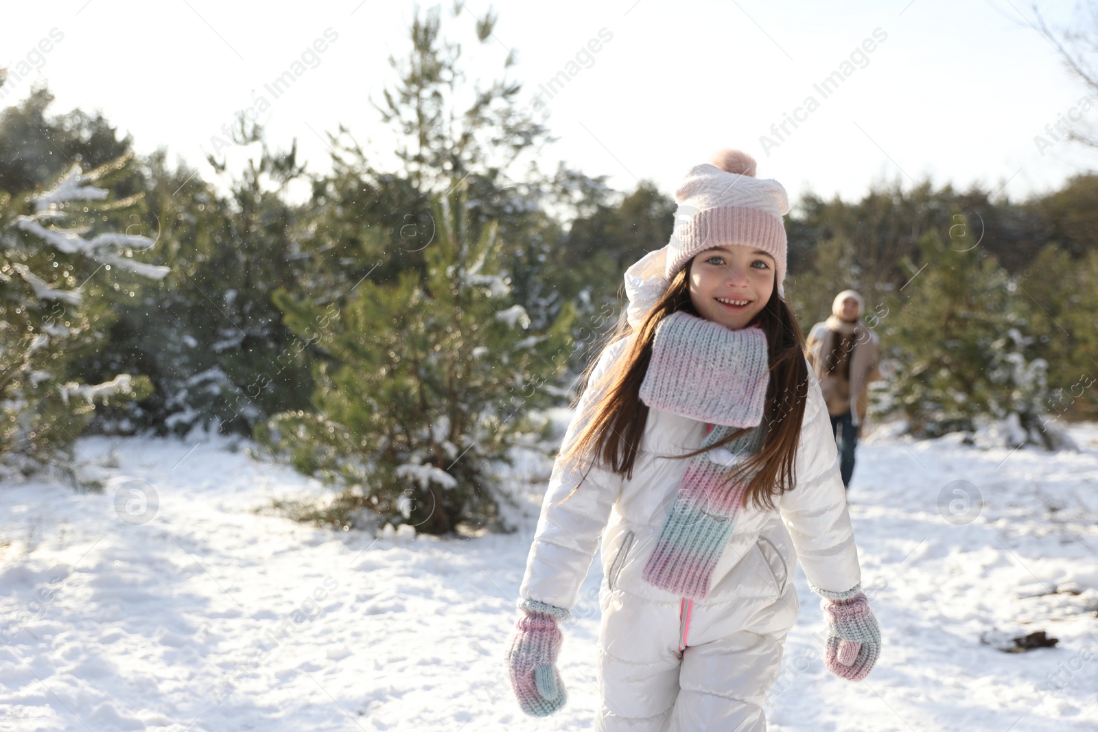 Photo of Cute little girl outdoors on winter day. Christmas vacation