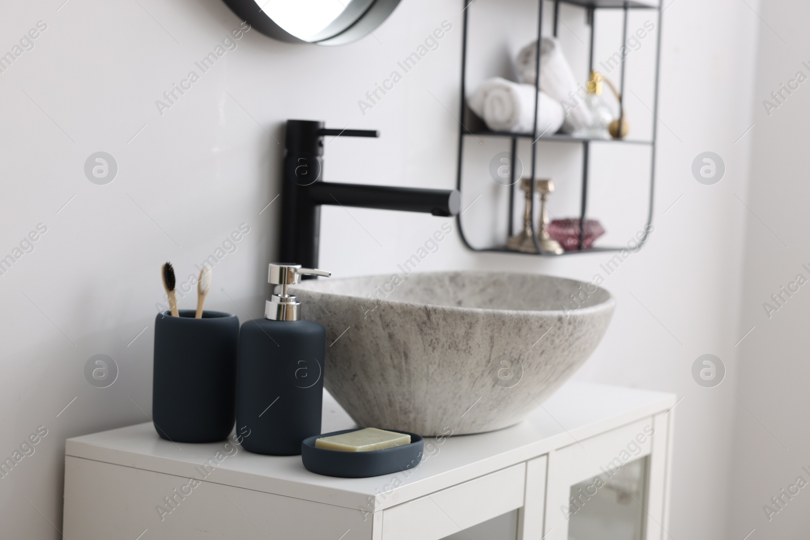 Photo of Different bath accessories, personal care products and bathroom vanity indoors