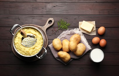 Photo of Flat lay composition with tasty mashed potatoes and ingredients on wooden table