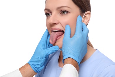 Photo of Doctor examining woman`s oral cavity on white background, closeup