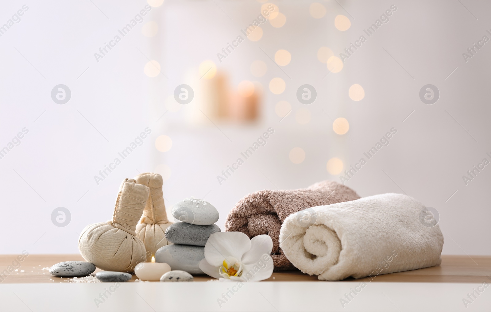 Photo of Beautiful spa composition on table in wellness center