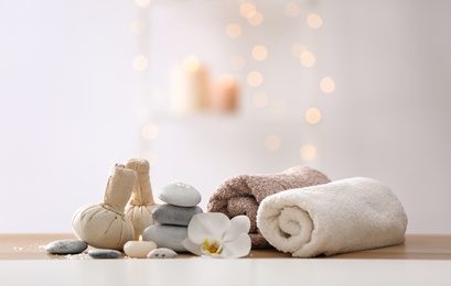 Photo of Beautiful spa composition on table in wellness center