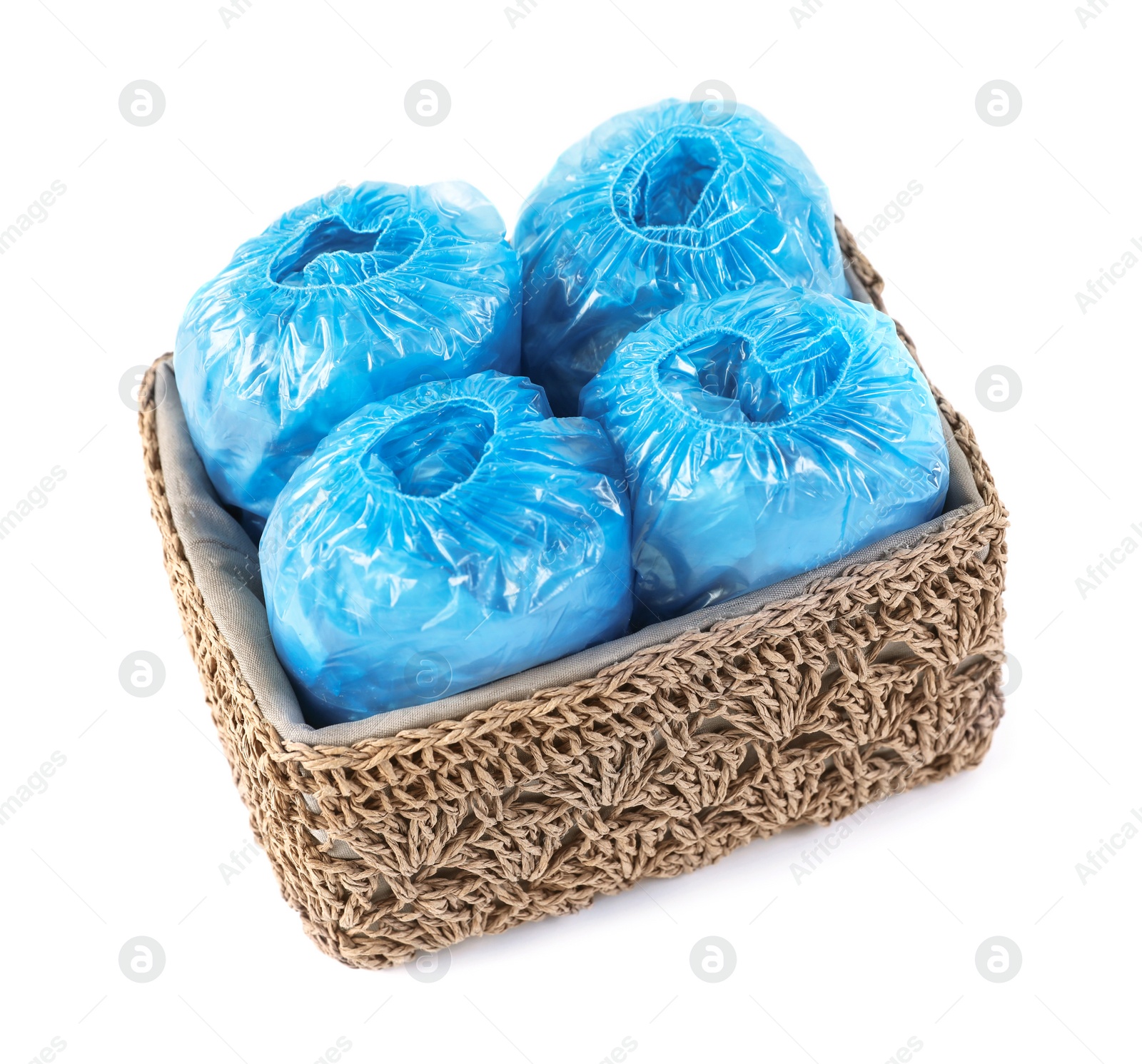 Photo of Box with medical blue shoe covers on white background