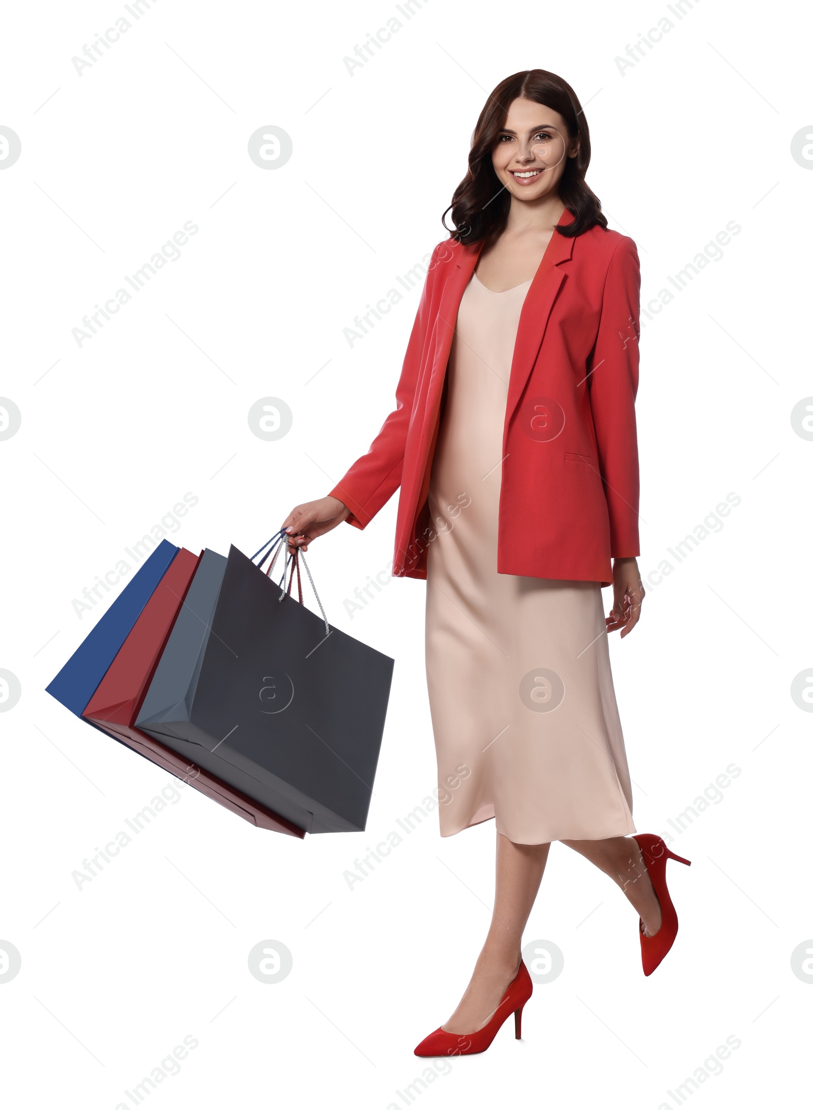 Photo of Beautiful young woman with paper shopping bags on white background