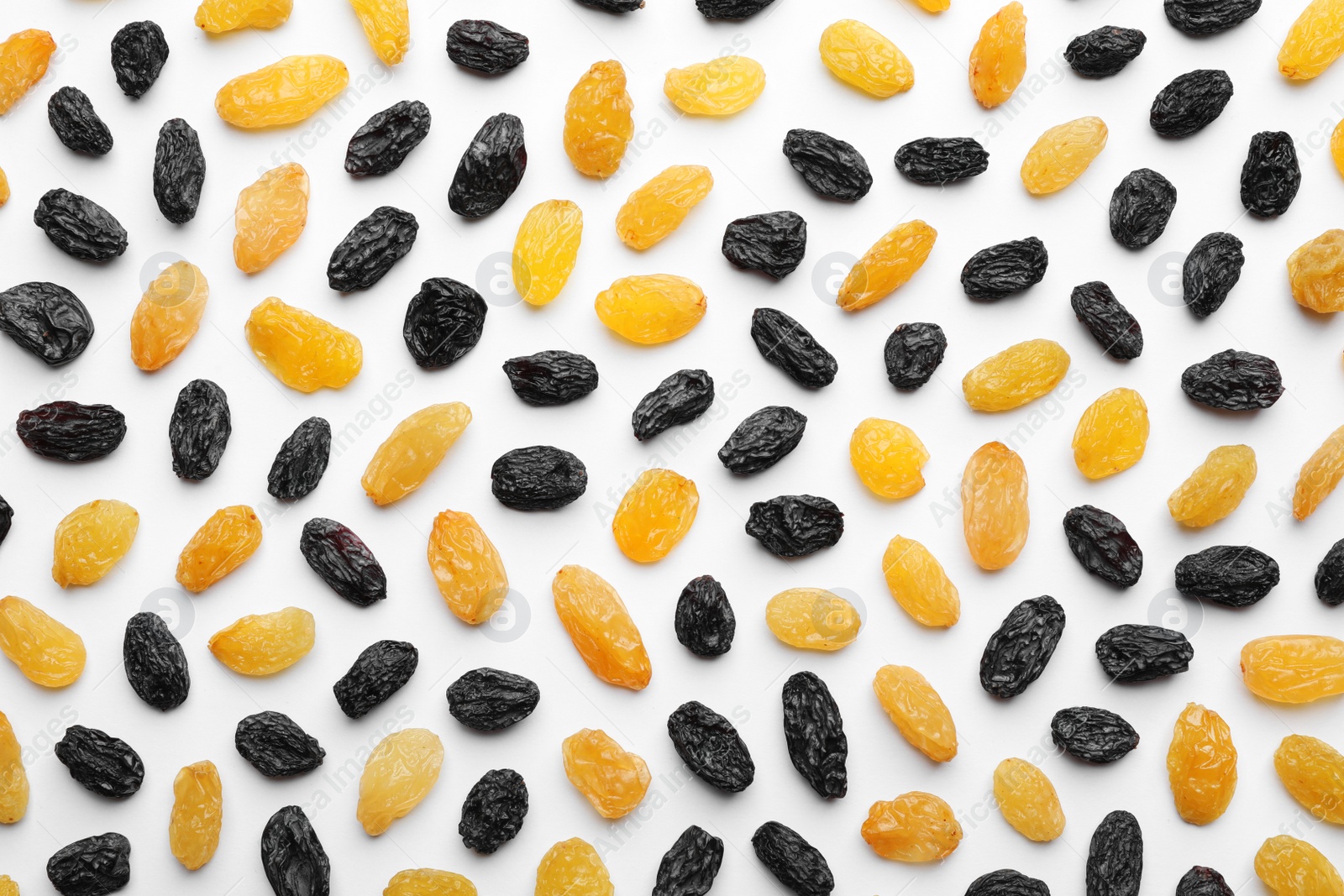 Photo of Composition with raisins on white background, top view. Dried fruit as healthy snack