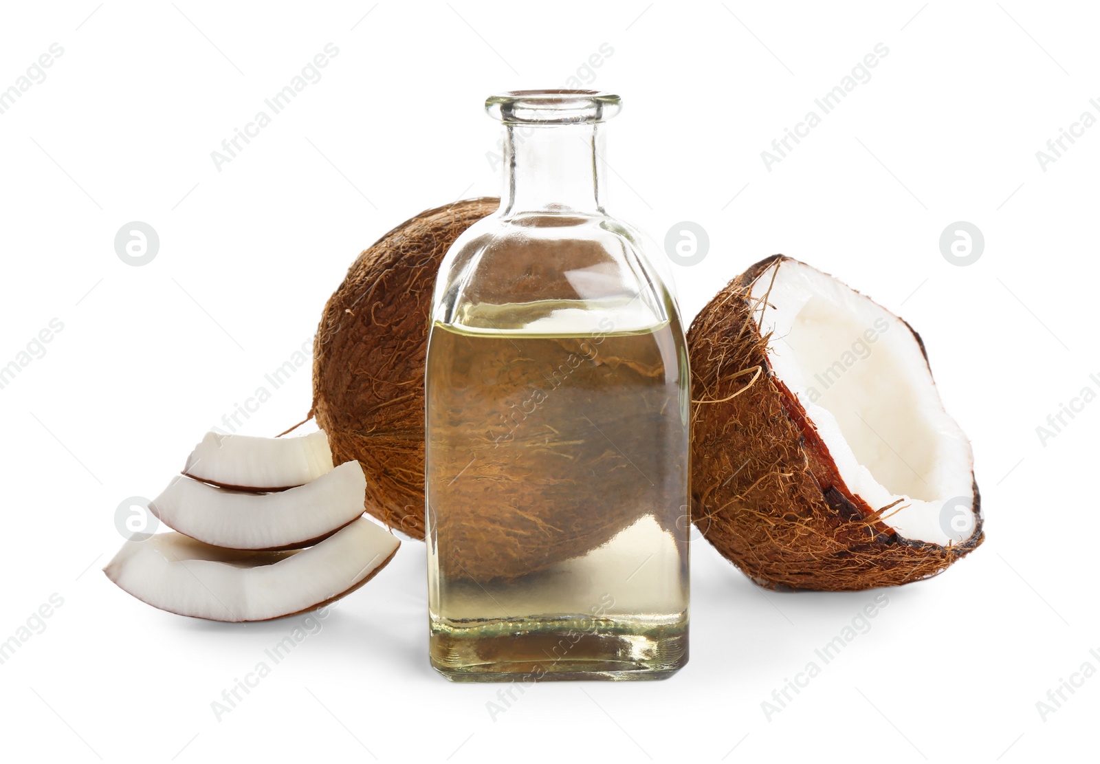 Photo of Ripe coconuts and bottle with natural organic oil on white background