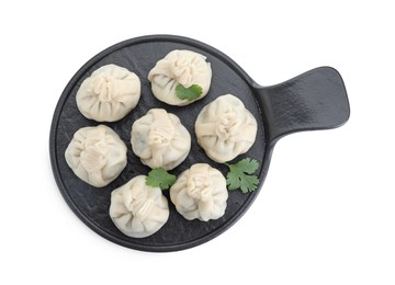 Serving board with tasty fresh khinkali (dumplings) and parsley isolated on white, top view. Georgian cuisine