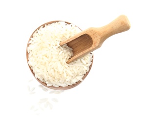 Photo of Bowl and scoop with uncooked rice on white background, top view