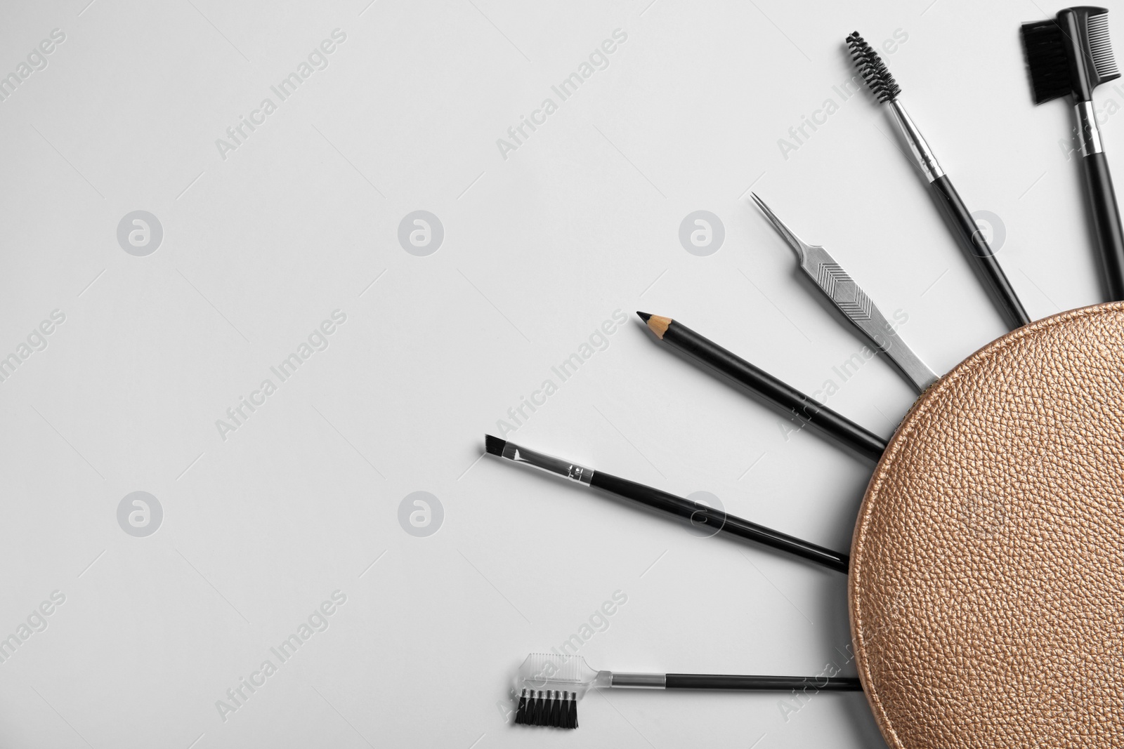 Photo of Set of professional eyebrow tools on white background, flat lay. Space for text